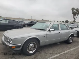 1989 Jaguar XJ z VIN SAJHY1546KC562355, wystawiony jako Copart lot #59936955 z przebiegiem 78 744 mil mil oraz Czysty tytuł • Clean title. Historia ofert i sprzedaży dostępna na DreamBid. Obrazek 1.