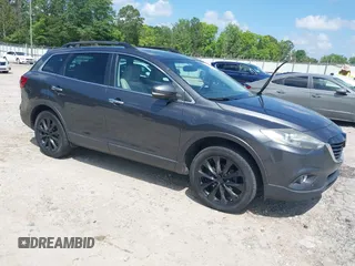 2014 Mazda CX-9 Grand Touring z VIN JM3TB2DA4E0436340, wystawiony jako IAAI lot #42442249 z przebiegiem 102 856 mil mil oraz . Historia ofert i sprzedaży dostępna na DreamBid. Obrazek 1.