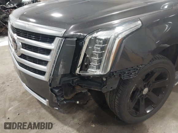 2015 Cadillac Escalade Premium with VIN 1GYS4CKJ8FR308617, listed as a IAAI auction lot 41974608 with 154,014 mi miles and . Bid and sale history available at DreamBid. Image 6.