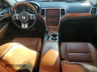 2013 Jeep Grand Cherokee Overland with VIN 1C4RJECG9DC644823, listed as a Copart auction lot 83232414 with 193,205 mi miles and Salvage Title. Bid and sale history available at carsss.com. Image 8.
