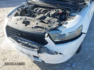 2014 Ford Police Interceptor z VIN 1FAHP2MK2EG125804, wystawiony jako IAAI lot #41297103 z przebiegiem 99 340 mil mil oraz . Historia ofert i sprzedaży dostępna na DreamBid. Obrazek 6.
