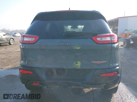 2014 Jeep Cherokee Trailhawk z VIN 1C4PJMBS2EW212341, wystawiony jako IAAI lot #40672694 z przebiegiem 108 622 mil mil oraz . Historia ofert i sprzedaży dostępna na DreamBid. Obrazek 16.