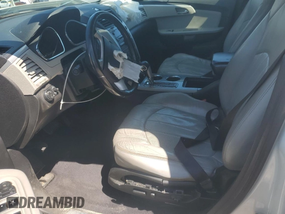 2012 Chevrolet Traverse LTZ z VIN 1GNKRLED5CJ233616, wystawiony jako Copart lot #52309145 z przebiegiem Nie podano mil oraz Szkoda całkowita • Salvage title. Historia ofert i sprzedaży dostępna na DreamBid. Obrazek 7.