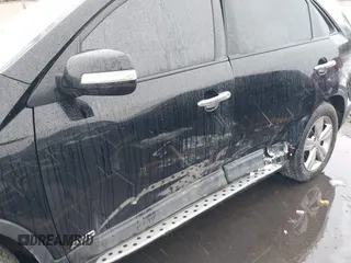 2012 Kia Sorento EX with VIN 5XYKUDA2XCG301636, listed as a IAAI auction lot 41619793 with 220,692 mi miles. Bid and sale history available at carsss.com. Image 6.
