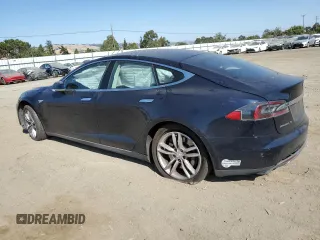 2013 Tesla Model S with VIN 5YJSA1AC9DFP10400, listed as a Copart auction lot 59047985 with 165,166 mi miles and Salvage title. Bid and sale history available at DreamBid. Image 2.