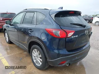 2015 Mazda CX-5 Touring with VIN JM3KE2CY5F0449195, listed as a IAAI auction lot 41894567 with 124,694 mi miles and . Bid and sale history available at DreamBid. Image 3.