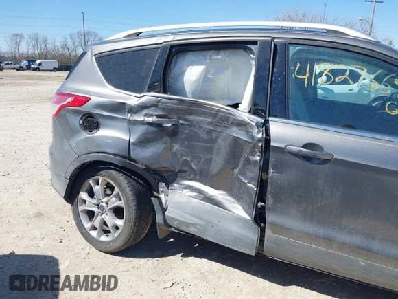2014 Ford Escape Titanium with VIN 1FMCU9J93EUC72752, listed as a IAAI auction lot 41827668 with 91,194 mi miles and . Bid and sale history available at DreamBid. Image 6.