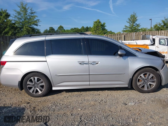 2014 Honda Odyssey Touring with VIN 5FNRL5H95EB108427, listed as a IAAI auction lot 39992643 with 100,658 mi miles and . Bid and sale history available at DreamBid. Image 13.