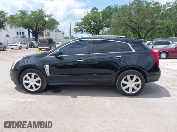 2015 Cadillac SRX Performance Collection z VIN 3GYFNCE31FS597798, wystawiony jako IAAI lot #42387793 z przebiegiem 159 986 mil mil oraz . Historia ofert i sprzedaży dostępna na DreamBid. Obrazek 14.