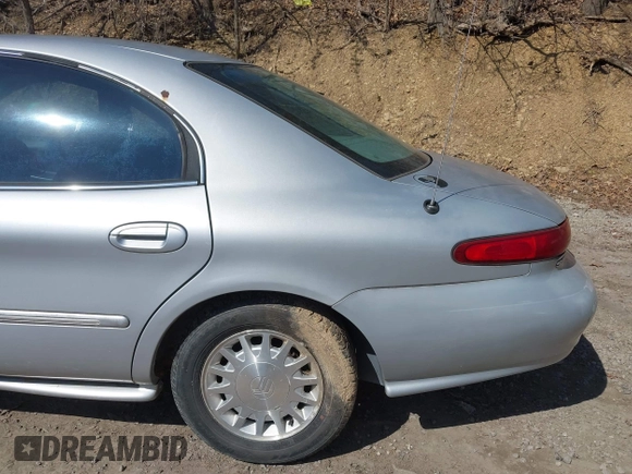 1999 Mercury Sable LS z VIN 1MEFM53S7XA622932, wystawiony jako IAAI lot #41708531 z przebiegiem 155 702 mil mil oraz . Historia ofert i sprzedaży dostępna na DreamBid. Obrazek 13.