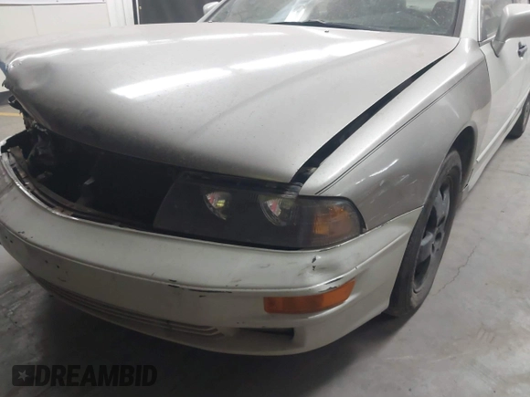 2003 Mitsubishi Diamante LS z VIN 6MMAP67P13T012396, wystawiony jako IAAI lot #40668729 z przebiegiem 157 250 mil mil oraz . Historia ofert i sprzedaży dostępna na DreamBid. Obrazek 6.