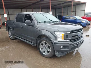 2019 Ford F-150 XL with VIN 1FTEW1C56KKC31025, listed as a IAAI auction lot 41452618 with 153,422 mi miles and . Bid and sale history available at carsss.com. Image 1.