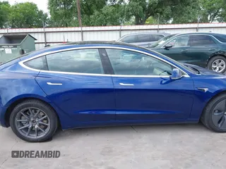 2019 Tesla Model 3 Mid Range with VIN 5YJ3E1EA5KF190453, listed as a IAAI auction lot 41880684 with 58,909 mi miles and . Bid and sale history available at carsss.com. Image 14.