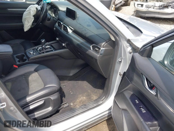 2020 Mazda CX-5 Touring with VIN JM3KFACM9L0785464, listed as a IAAI auction lot 42023311 with 90,062 mi miles and . Bid and sale history available at DreamBid. Image 5.