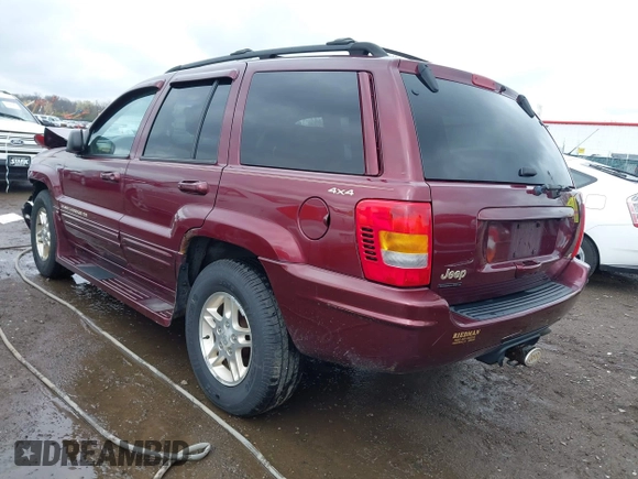 1999 Jeep Grand Cherokee Limited with VIN 1J4GW68N5XC642670, listed as a IAAI auction lot 41990199 with 154,492 mi miles. Bid and sale history available at carsss.com. Image 3.