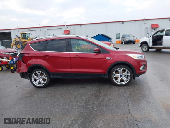 2019 Ford Escape Titanium z VIN 1FMCU9J99KUA18880, wystawiony jako IAAI lot #40830436 z przebiegiem 117 499 mil mil oraz . Historia ofert i sprzedaży dostępna na DreamBid. Obrazek 13.