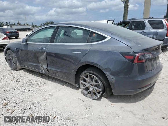 2019 Tesla Model 3 Mid Range z VIN 5YJ3E1EA4KF434741, wystawiony jako Copart lot #53857935 z przebiegiem Nie podano mil oraz Szkody całkowita. Historia ofert i sprzedaży dostępna na DreamBid. Obrazek 2.