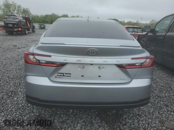 2025 Toyota Camry LE with VIN 4T1DAACKXSU043785, listed as a Copart auction lot 52207785 with 9,410 mi miles and Salvage Title. Bid and sale history available at DreamBid. Image 6.