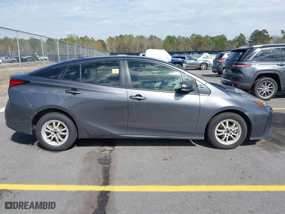 2021 Toyota Prius L Eco with VIN JTDKAMFU4M3134778, listed as a IAAI auction lot 41843429 with 145,757 mi miles. Bid and sale history available at carsss.com. Image 13.
