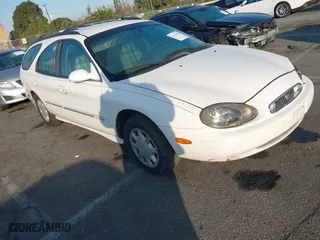 1998 Mercury Sable LS with VIN 1MEFM55U1WG608826, listed as a IAAI auction lot 41433046 with 138,291 mi miles. Bid and sale history available at carsss.com. Image 1.