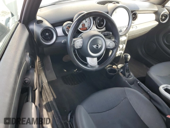 2010 MINI Convertible with VIN WMWMR3C55ATU97172, listed as a Copart auction lot 42726215 with 99,164 mi miles and Salvage Title. Bid and sale history available at DreamBid. Image 8.