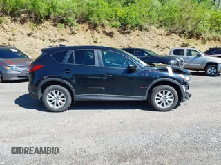 2016 Mazda CX-5 Touring with VIN JM3KE4CY4G0738713, listed as a IAAI auction lot 41998597 with 146,595 mi miles and . Bid and sale history available at carsss.com. Image 13.