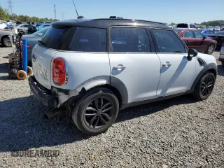 2011 MINI Countryman with VIN WMWZB3C56BWM00040, listed as a Copart auction lot 48660435 with 146,607 mi miles and Salvage title. Bid and sale history available at DreamBid. Image 3.