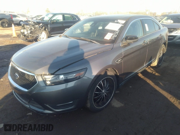 2014 Ford Taurus SHO with VIN 1FAHP2KT4EG140364, listed as a IAAI auction lot 35451709 with 82,904 mi miles. Bid and sale history available at carsss.com. Image 2.
