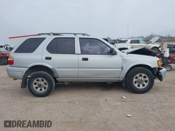 1999 Isuzu Rodeo S with VIN 4S2CK58W4X4358898, listed as a IAAI auction lot 41360738 with 184,948 mi miles and . Bid and sale history available at carsss.com. Image 13.