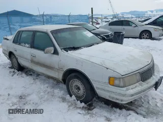 1991 Lincoln Continental with VIN 1LNCM9745MY632946, listed as a IAAI auction lot 41561785 with 124,186 mi miles and . Bid and sale history available at DreamBid. Image 1.