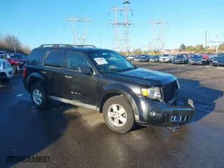 2011 Ford Escape XLT with VIN 1FMCU9DG4BKC30933, listed as a IAAI auction lot 40828476 with 146,808 mi miles. Bid and sale history available at carsss.com. Image 1.
