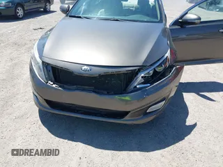2014 Kia Optima LX with VIN 5XXGM4A71EG335165, listed as a IAAI auction lot 42052378 with 154,574 mi miles. Bid and sale history available at carsss.com. Image 6.
