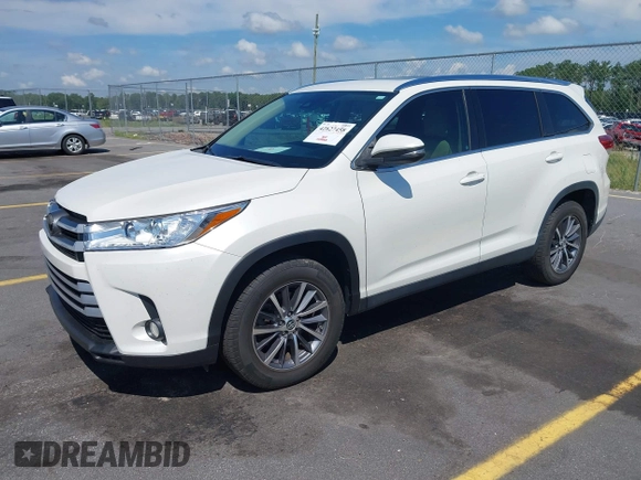 2019 Toyota Highlander SE with VIN 5TDKZRFH7KS551929, listed as a IAAI auction lot 42627458 with 84,117 mi miles and . Bid and sale history available at DreamBid. Image 2.