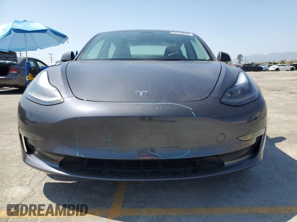 2023 Tesla Model 3 with VIN 5YJ3E1EA3PF695267, listed as a Copart auction lot 52559645 with 9,025 mi miles and Salvage title. Bid and sale history available at DreamBid. Image 5.