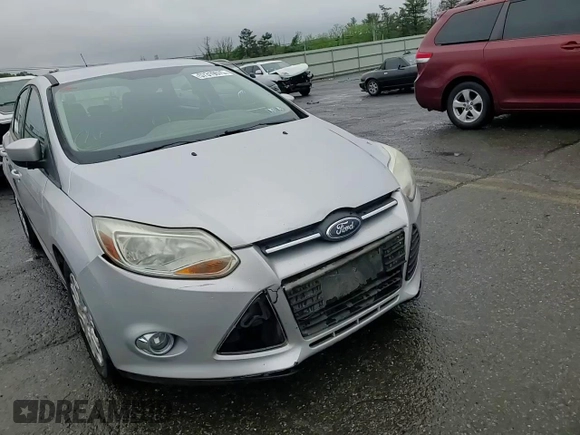 2012 Ford Focus SE z VIN 1FAHP3K2XCL270196, wystawiony jako Copart lot #57319575 z przebiegiem 80 364 mil mil oraz Szkoda całkowita • Salvage title. Historia ofert i sprzedaży dostępna na DreamBid. Obrazek 13.