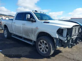 2021 Ram 2500 Laramie z VIN 3C6UR5FL9MG520549, wystawiony jako IAAI lot #41795812 z przebiegiem 88 474 mil mil oraz . Historia ofert i sprzedaży dostępna na DreamBid. Obrazek 1.