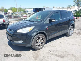 2013 Ford Escape SEL with VIN 1FMCU9H97DUA51529, listed as a IAAI auction lot 42164245 with 106,649 mi miles and . Bid and sale history available at DreamBid. Image 2.