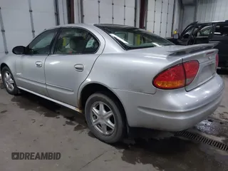 2003 Oldsmobile Alero GL1 z VIN 1G3NL52F53C112582, wystawiony jako IAAI lot #41926039 z przebiegiem 124 769 mil mil oraz . Historia ofert i sprzedaży dostępna na DreamBid. Obrazek 3.