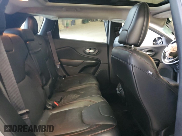 2014 Jeep Cherokee Trailhawk with VIN 1C4PJMBSXEW213981, listed as a Copart auction lot 60440495 with 136,612 mi miles and Salvage title. Bid and sale history available at DreamBid. Image 11.