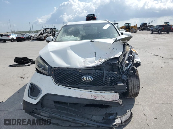 2017 Kia Sorento LX z VIN 5XYPG4A34HG220340, wystawiony jako Copart lot #57467775 z przebiegiem 144 612 mil mil oraz Szkoda całkowita • Salvage title. Historia ofert i sprzedaży dostępna na DreamBid. Obrazek 5.