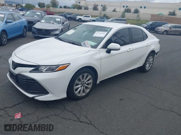 2020 Toyota Camry LE with VIN 4T1C11AK3LU882824, listed as a IAAI auction lot 41765544 with 48,209 mi miles and . Bid and sale history available at carsss.com. Image 2.