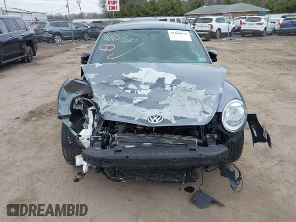 2012 Volkswagen Beetle with VIN 3VWV67AT0CM663718, listed as a IAAI auction lot 41860510 with 99,932 mi miles and . Bid and sale history available at DreamBid. Image 13.