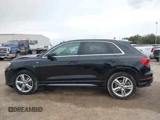 2020 Audi Q3 S line Premium z VIN WA1DECF34L1088002, wystawiony jako IAAI lot #41332352 z przebiegiem 41 196 mil mil oraz . Historia ofert i sprzedaży dostępna na DreamBid. Obrazek 14.