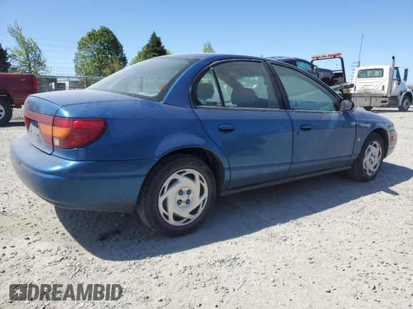 2001 Saturn SL z VIN 1G8ZK547X1Z294553, wystawiony jako Copart lot #53786805 z przebiegiem 288 011 mil mil oraz Szkody całkowita. Historia ofert i sprzedaży dostępna na DreamBid. Obrazek 3.