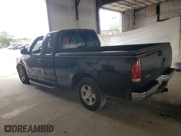 1999 Ford F-150 with VIN 1FTZX1723XNA24144, listed as a Copart auction lot 58071155 with 320,829 mi miles and Salvage title. Bid and sale history available at DreamBid. Image 2.