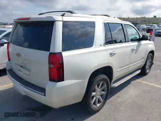 2015 Chevrolet Tahoe LTZ with VIN 1GNSCCKC4FR142856, listed as a IAAI auction lot 39886899 with 134,301 mi miles. Bid and sale history available at carsss.com. Image 4.