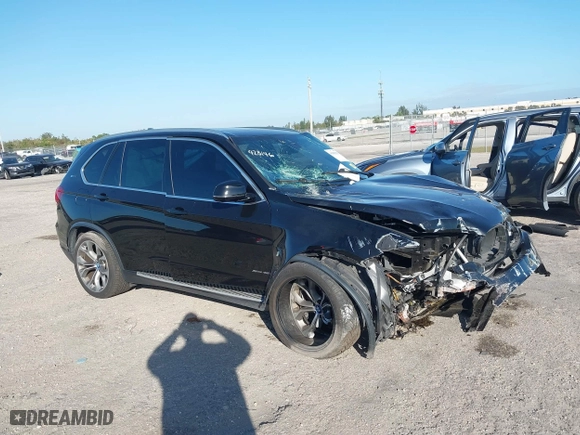 2018 BMW X5 xDrive40e iPerformance with VIN 5UXKT0C59J0W00801, listed as a IAAI auction lot 41081133 with 63,265 mi miles. Bid and sale history available at carsss.com. Image 1.