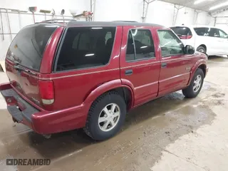 1999 Oldsmobile Bravada with VIN 1GHDT13W9X2701952, listed as a IAAI auction lot 42093184 with 121,532 mi miles. Bid and sale history available at carsss.com. Image 4.