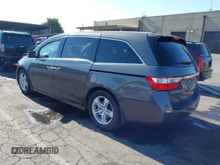 2012 Honda Odyssey Touring with VIN 5FNRL5H95CB057346, listed as a IAAI auction lot 42644094 with 114,712 mi miles and . Bid and sale history available at DreamBid. Image 3.