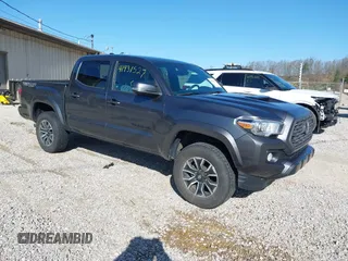2022 Toyota Tacoma SR with VIN 3TMCZ5ANXNM508653, listed as a IAAI auction lot 41931527 with 74,095 mi miles and . Bid and sale history available at DreamBid. Image 1.